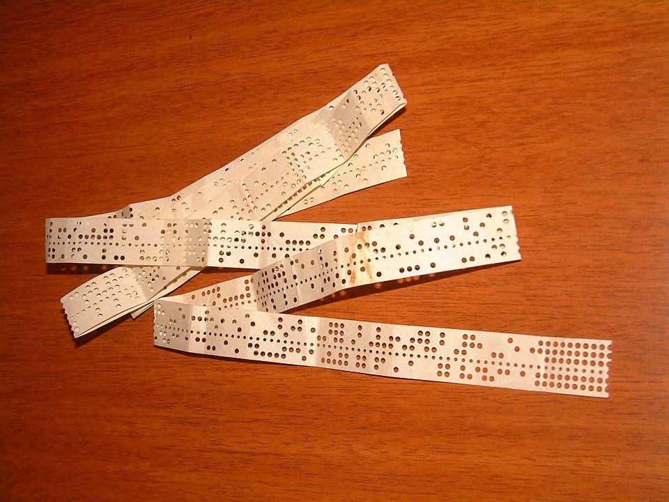 A perforated tape holding Baudot code